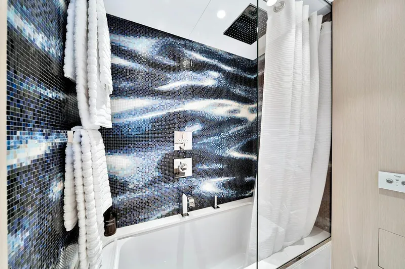 Slide: The Image of Luxurious bathroom in 2024 Baglietto DOM 133 yacht with mosaic tile design. - 112