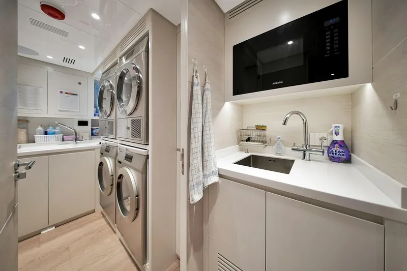 Slide: The Image of Laundry room on 2024 Baglietto DOM 133 yacht with modern appliances and sleek design. - 115