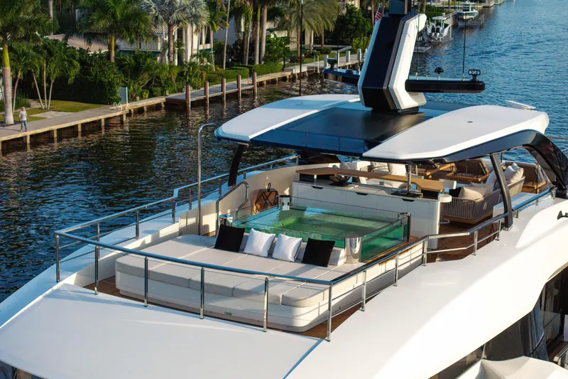 Slide: The Image of Luxurious 2024 Baglietto DOM 133 yacht with elegant deck and pool, docked by waterfront. - 12