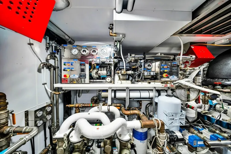 Slide: The Image of Engine room of 2024 Baglietto DOM 133 yacht, featuring complex machinery and control panels. - 126