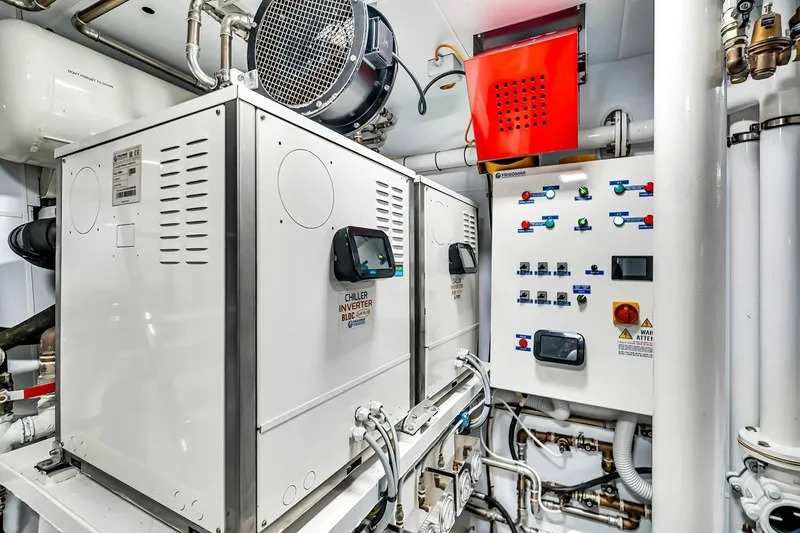 Slide: The Image of Engine room of 2024 Baglietto DOM 133 yacht with control panels and machinery. - 129