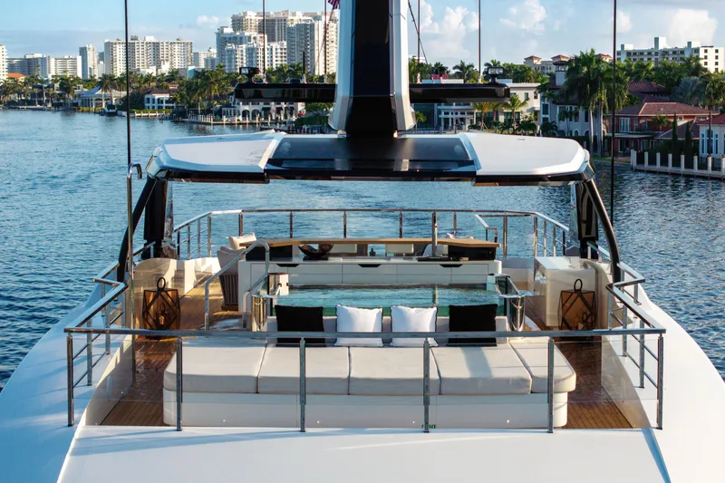 Slide: The Image of Luxurious 2024 Baglietto DOM 133 yacht with elegant deck and scenic waterfront view. - 13