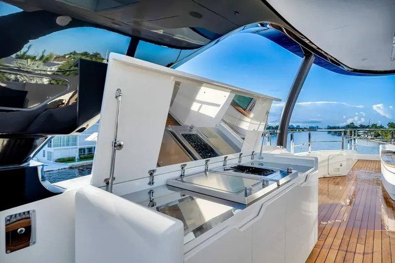 Slide: The Image of Luxurious outdoor kitchen on 2024 Baglietto DOM 133 yacht with scenic water view. - 24