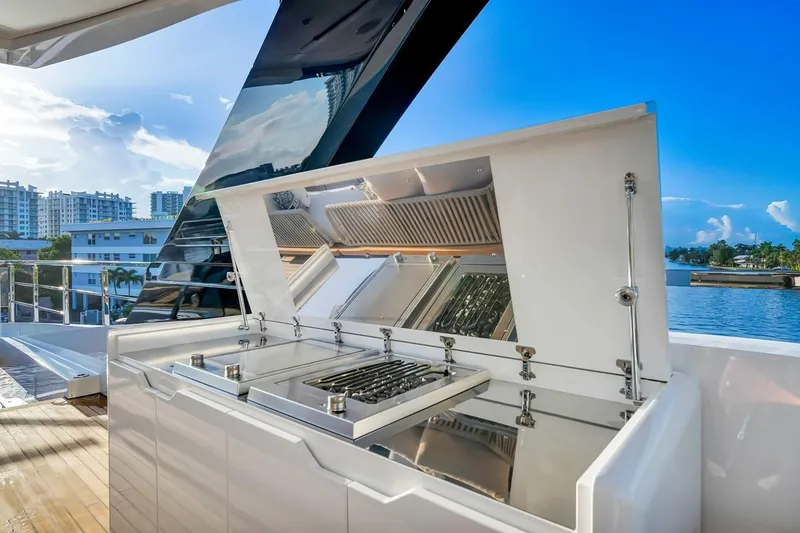 Slide: The Image of Outdoor kitchen on 2024 Baglietto DOM 133 yacht with scenic waterfront view. - 28