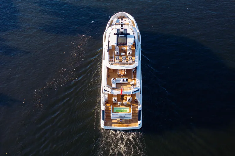 Slide: The Image of Aerial view of 2024 Baglietto DOM 133 yacht cruising on open water. - 3