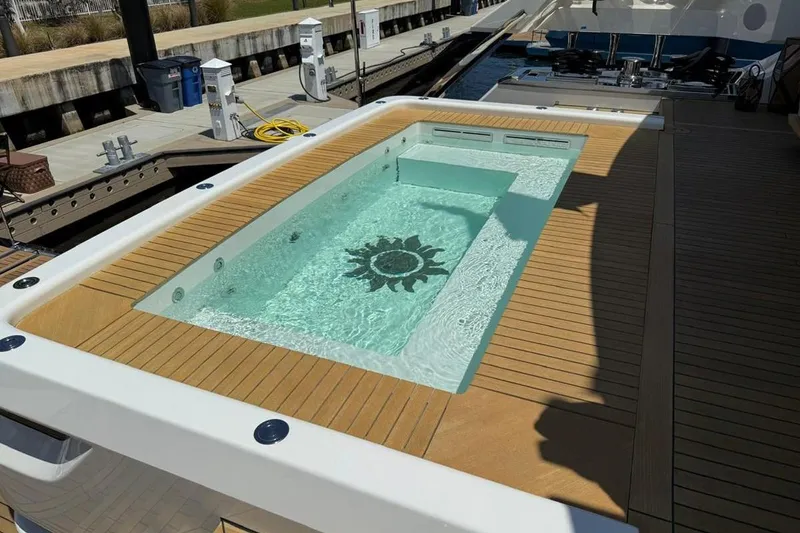 Slide: The Image of Luxurious pool on 2024 Baglietto DOM 133 yacht, featuring elegant wooden deck. - 36
