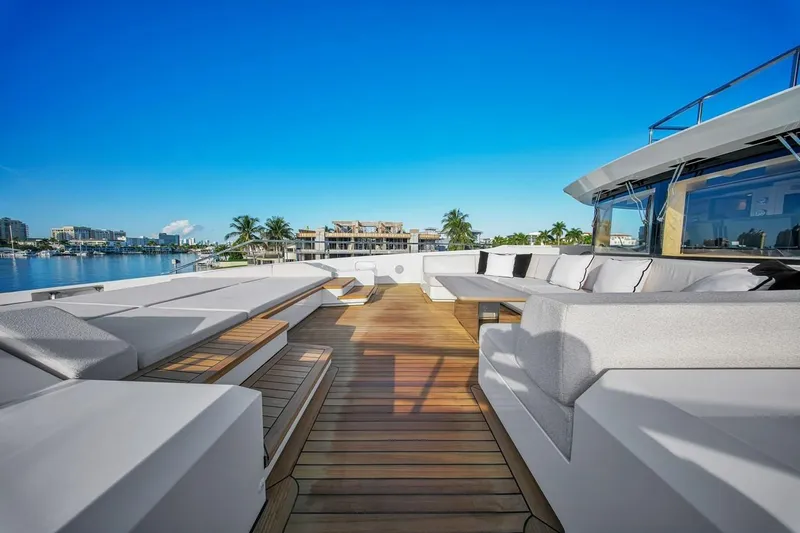 Slide: The Image of Luxurious 2024 Baglietto DOM 133 yacht deck with elegant seating and stunning waterfront view. - 39