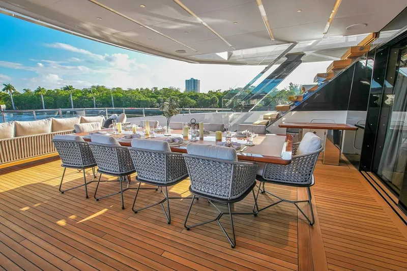 Slide: The Image of Luxurious dining area on 2024 Baglietto DOM 133 yacht with elegant seating and scenic views. - 41