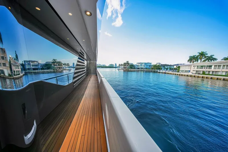 Slide: The Image of Luxurious 2024 Baglietto DOM 133 yacht cruising along a scenic waterfront. - 42