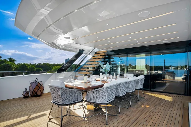 Slide: The Image of Luxurious outdoor dining area on 2024 Baglietto DOM 133 yacht, featuring elegant seating and scenic views. - 47