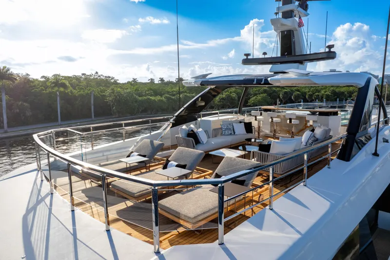 Slide: The Image of Luxurious 2024 Baglietto DOM 133 yacht deck with elegant seating and scenic views. - 5