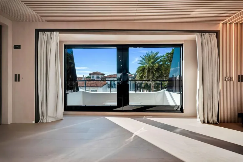 Slide: The Image of Modern interior view from Baglietto DOM 133 yacht, showcasing large windows and scenic outdoor view. - 50