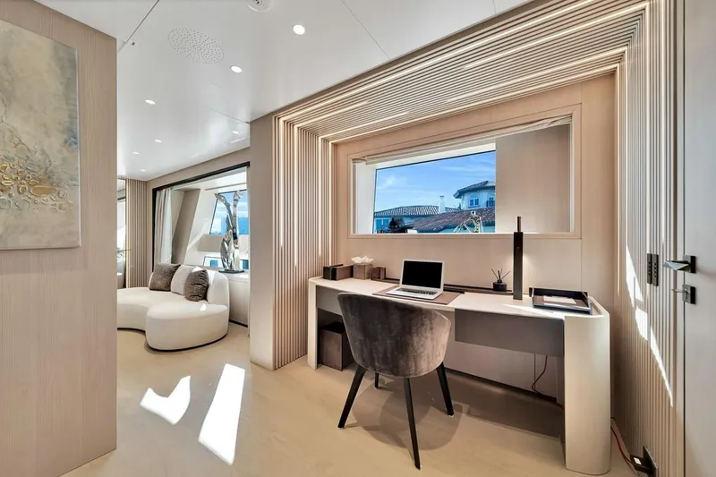 Slide: The Image of Luxurious interior of 2024 Baglietto DOM 133 yacht with modern desk and seating area. - 79