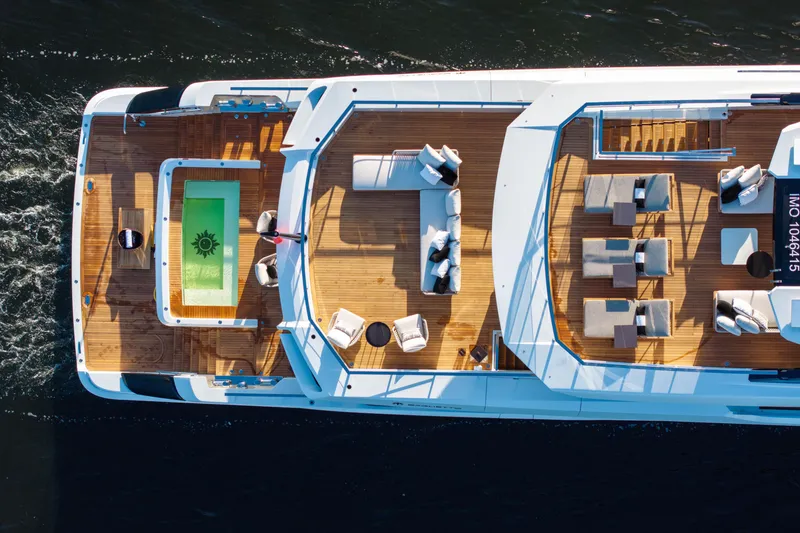 Slide: The Image of Aerial view of 2024 Baglietto DOM 133 yacht with luxurious deck and pool. - 8