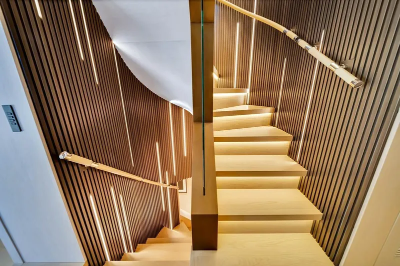 Slide: The Image of Modern staircase with wooden slats and ambient lighting on Baglietto DOM 133 yacht, 2024 model. - 88