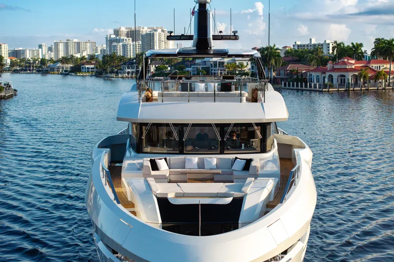 Slide: The Image of Luxurious 2024 Baglietto DOM 133 yacht cruising near waterfront cityscape. - 9