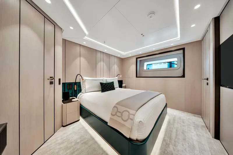 Slide: The Image of Luxurious bedroom interior of 2024 Baglietto DOM 133 yacht with modern design and ambient lighting. - 98