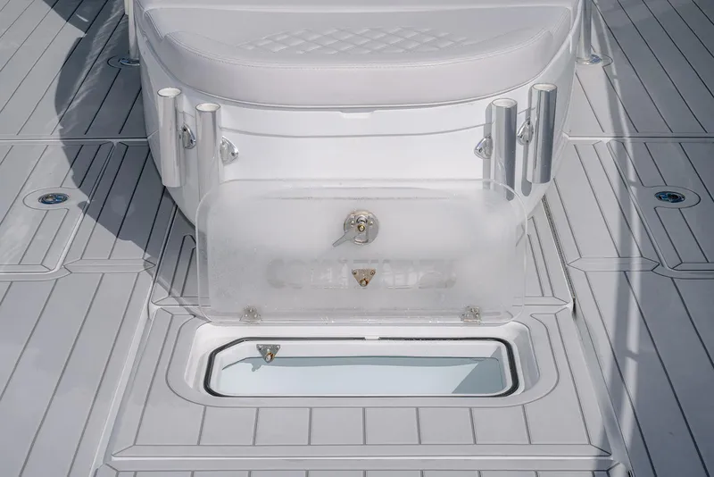 Slide: The Image of 2020 Contender 44ST boat deck with storage compartment and rod holders. - 16