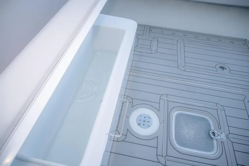 Slide: The Image of Contender 44 ST 2020 boat deck with integrated storage and measurement features. - 18