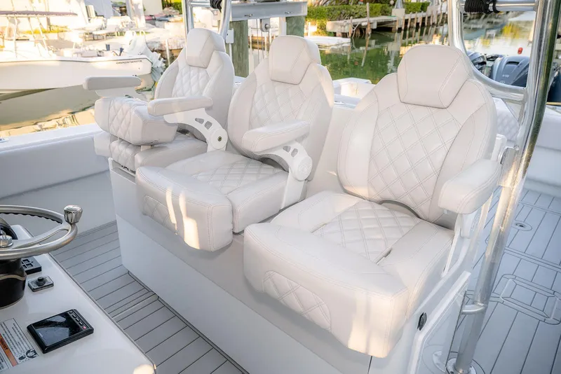 Slide: The Image of Luxurious white seating on a 2020 Contender 44 ST boat, featuring diamond-stitched upholstery. - 20