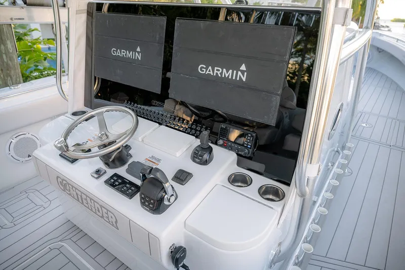 Slide: The Image of Helm of 2020 Contender 44 ST boat with Garmin navigation displays. - 21