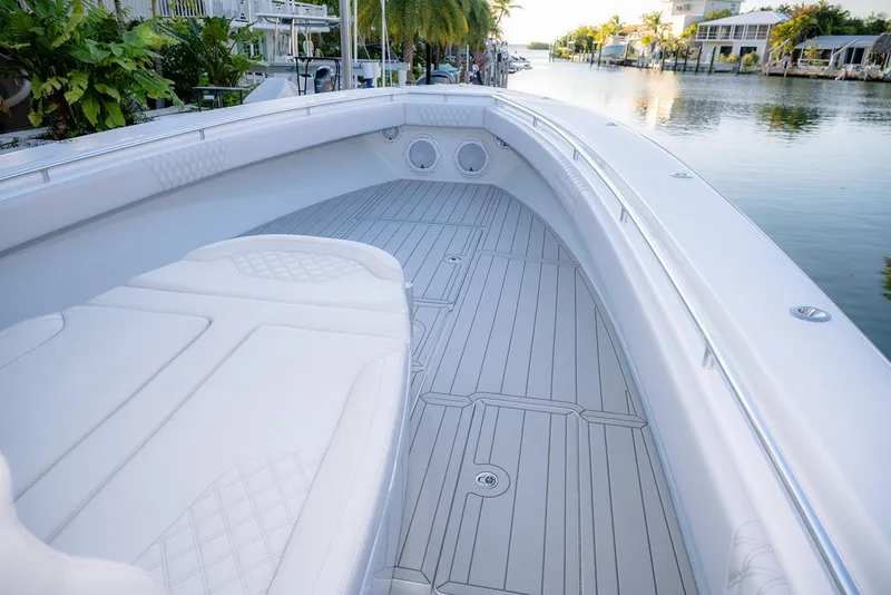 Slide: The Image of 2020 Contender 44 ST boat interior with sleek white seating and spacious deck. - 24