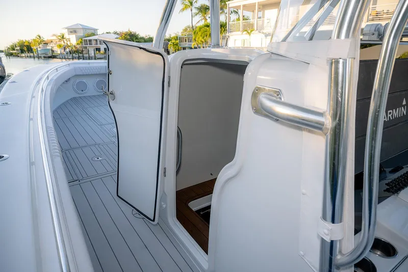 Slide: The Image of 2020 Contender 44 ST boat interior with open cabin door, sleek design, and modern features. - 31