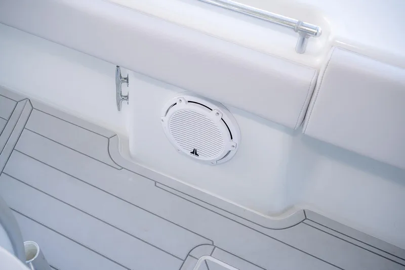 Slide: The Image of 2020 Contender 44 ST boat interior with speaker and cushioned seating. - 32