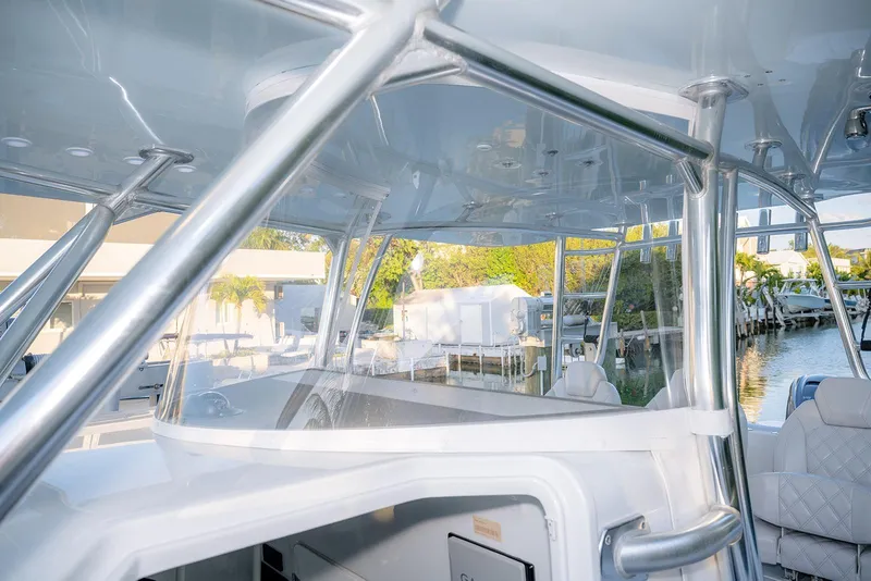 Slide: The Image of 2020 Contender 44 ST boat interior with sleek metal framework and waterfront view. - 34