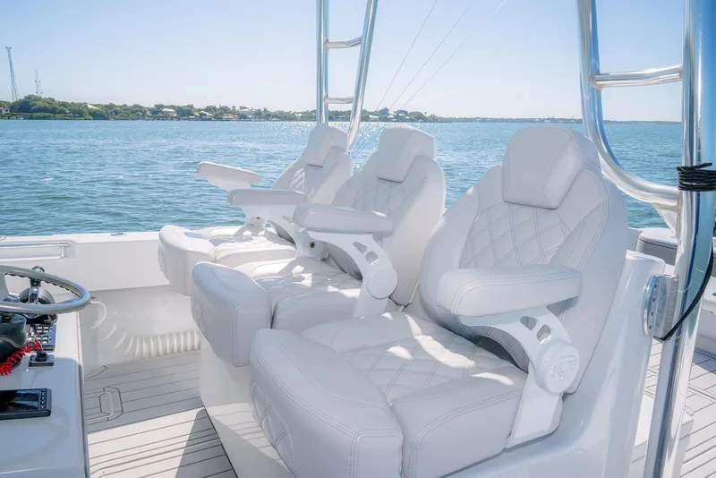 Slide: The Image of 2020 Contender 44ST boat with luxurious white seating on a sunny day. - 9