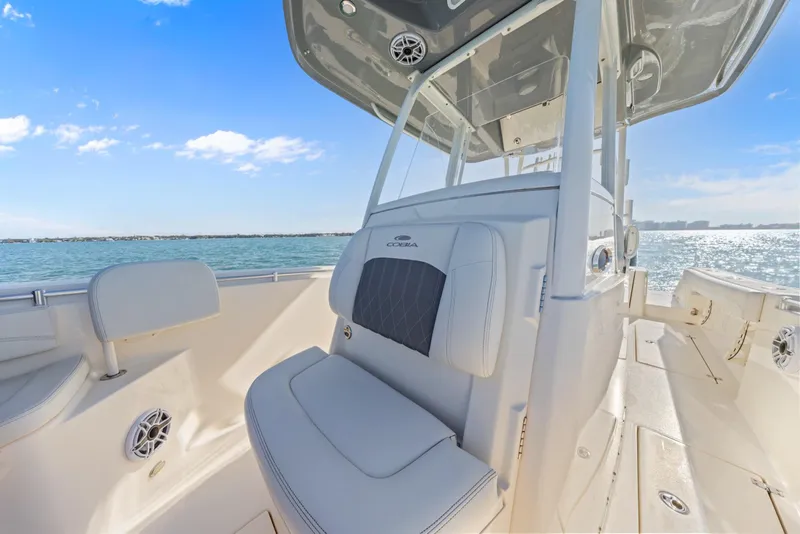 Slide: The Image of 2023 Cobia 301 Center Console boat interior with ocean view and clear blue sky. - 14