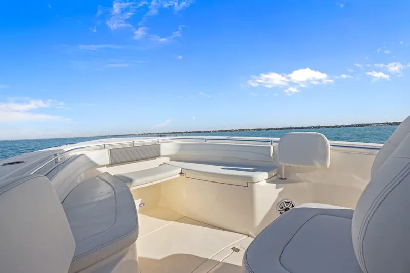 Slide: The Image of 2023 Cobia 301 Center Console boat interior with ocean view and blue sky. - 9