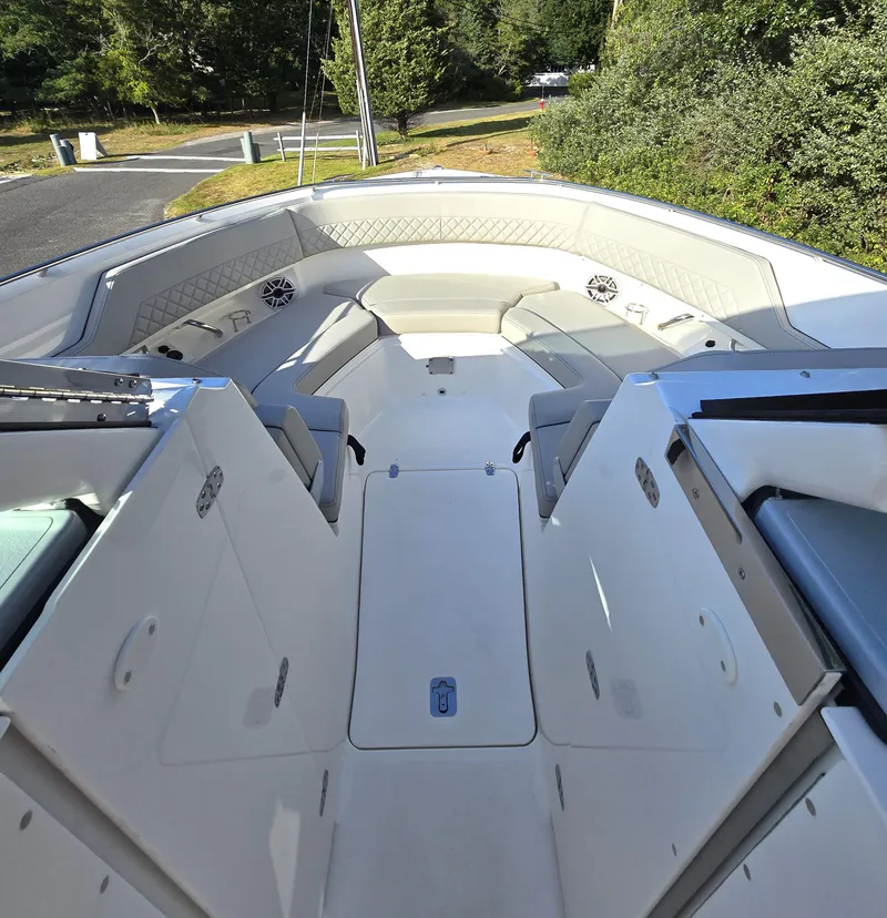 Slide: The Image of 2025 Pursuit DC 326 boat interior with spacious seating and modern design. - 16