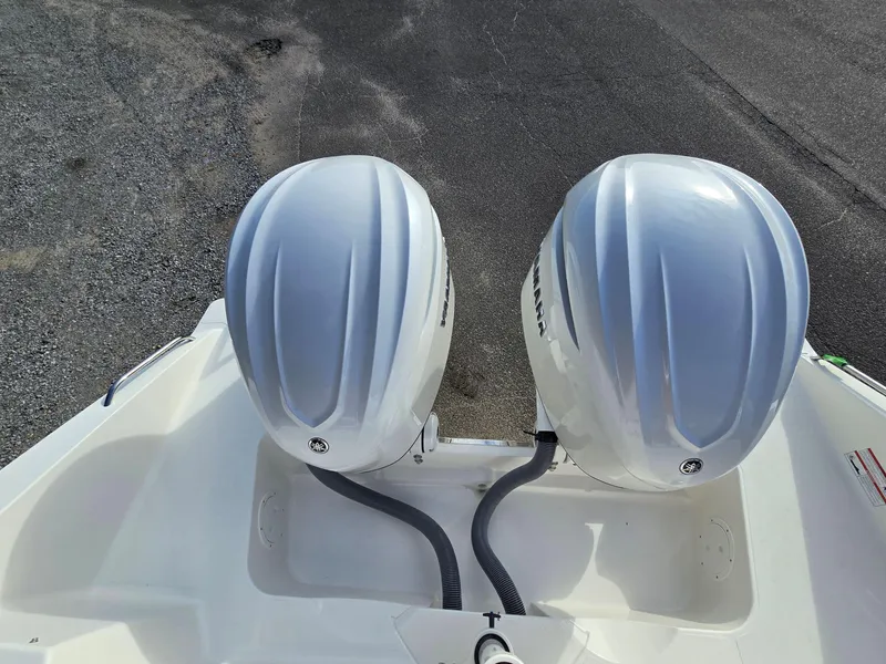 Slide: The Image of 2025 Pursuit DC 326 boat with dual outboard engines, top view. - 2