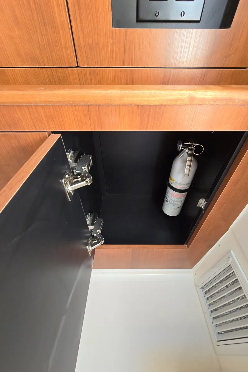 Slide: The Image of 2025 Pursuit DC 326 cabinet with fire extinguisher inside. - 25