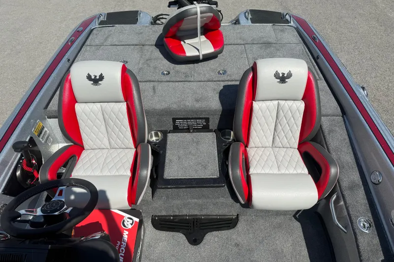 Slide: The Image of 2026 Phoenix 819 ZXL boat interior with red and gray seats, steering wheel, and console. - 11