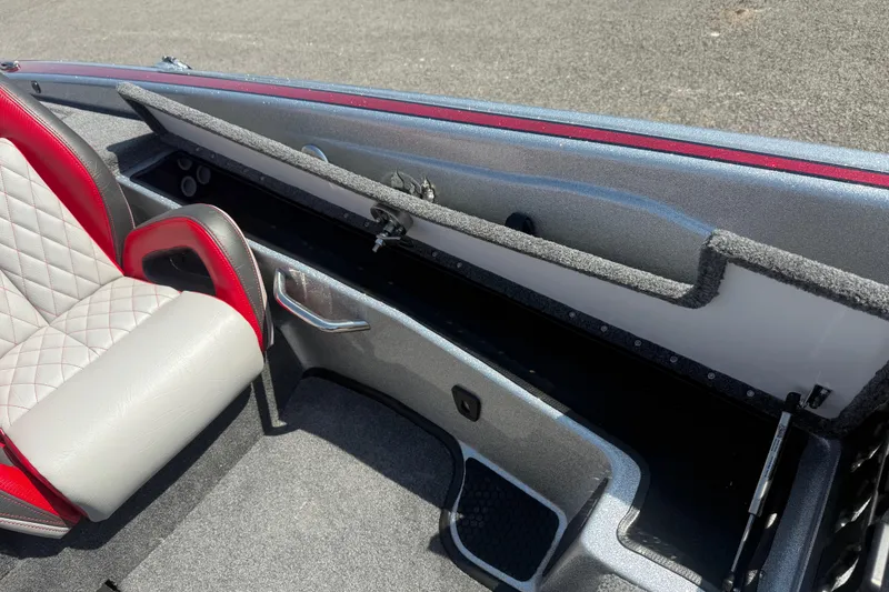Slide: The Image of Interior of 2026 Phoenix 819 ZXL boat with red and gray seating and storage compartment. - 15