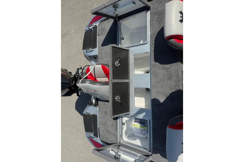 Slide: The Image of Open storage compartments on a 2026 Phoenix 819 ZXL boat deck. - 16