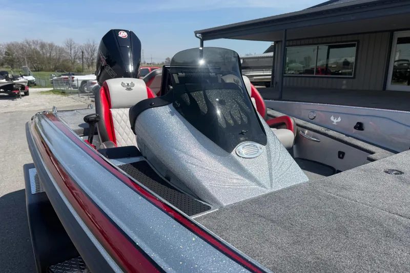 Slide: The Image of 2026 Phoenix 819 ZXL boat with sleek design and modern features, parked outdoors. - 6