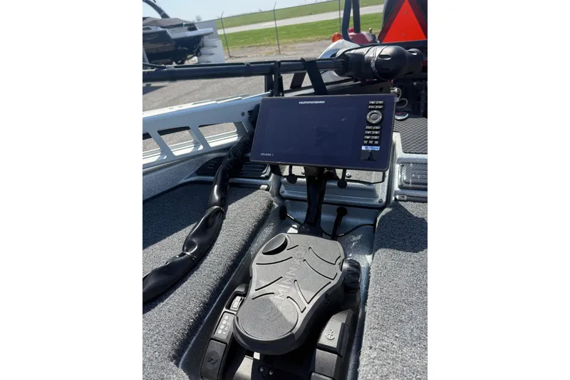 Slide: The Image of 2026 Phoenix 819 ZXL boat dashboard with Humminbird fishfinder and foot pedal controls. - 9