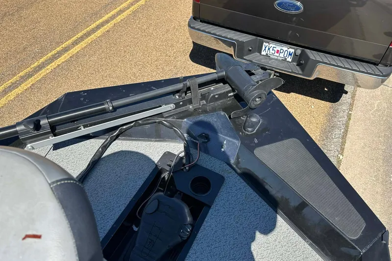 Slide: The Image of 2020 G3 Sportsman 1610 Camo boat with trolling motor, parked behind a truck. - 11