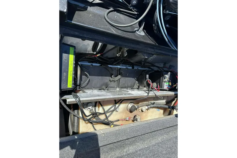 Slide: The Image of 2020 G3 Sportsman 1610 Camo boat battery compartment with wiring and components. - 12