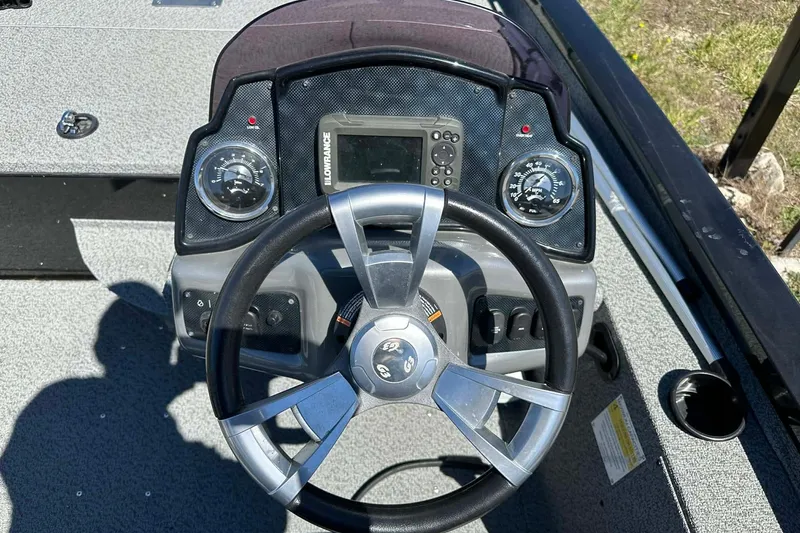 Slide: The Image of Steering console of 2020 G3 Sportsman 1610 Camo boat with gauges and controls. - 15
