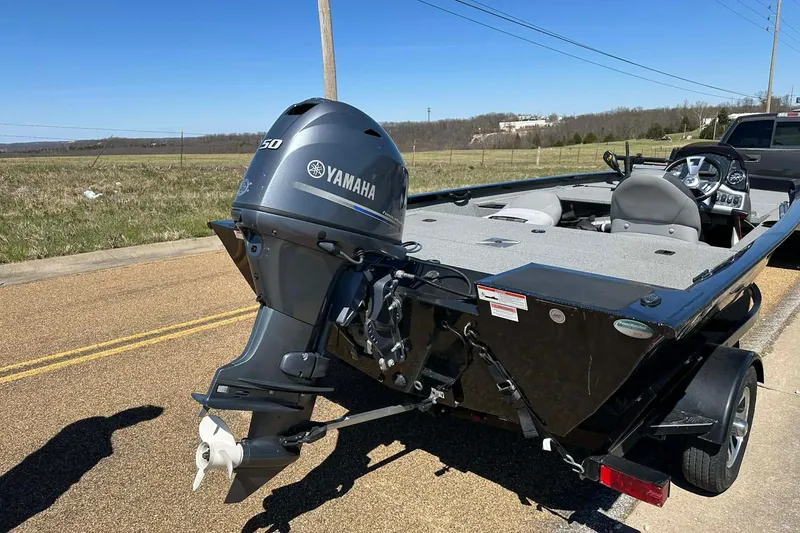Slide: The Image of 2020 G3 Sportsman 1610 Camo boat with Yamaha outboard motor on trailer. - 17