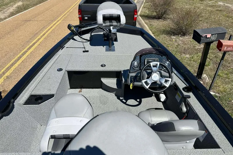 Slide: The Image of 2020 G3 Sportsman 1610 Camo boat interior with steering wheel and seating. - 21