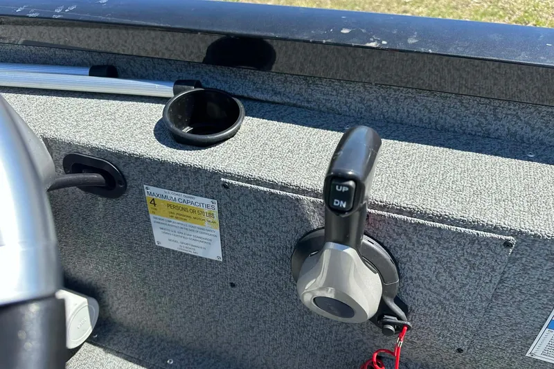 Slide: The Image of 2020 G3 Sportsman 1610 Camo boat control panel with throttle and capacity label. - 4