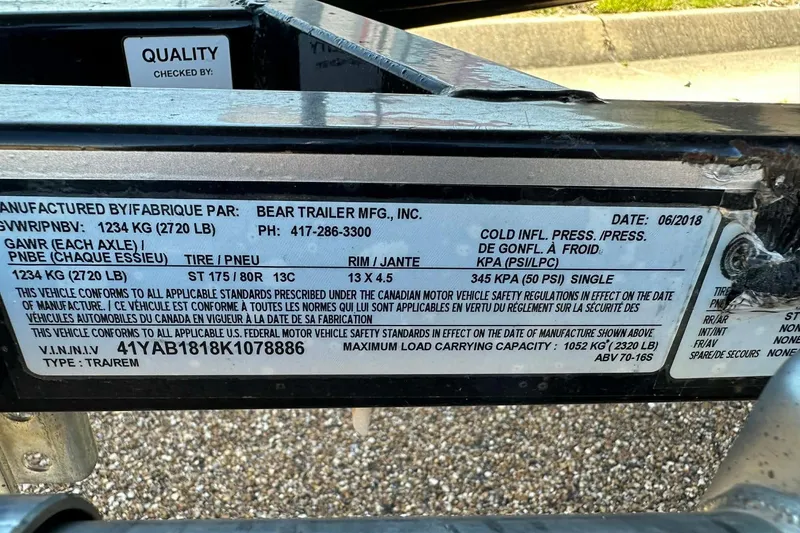 Slide: The Image of Label on a Bear Trailer MFG, Inc., detailing specifications and compliance information. - 6