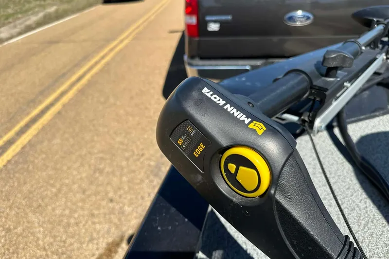 Slide: The Image of Minn Kota trolling motor on 2020 G3 Sportsman 1610 Camo boat, parked on road. - 7