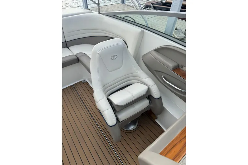 Slide: The Image of Luxury seating on a 2000 Cobalt 226 boat with teak flooring. - 11