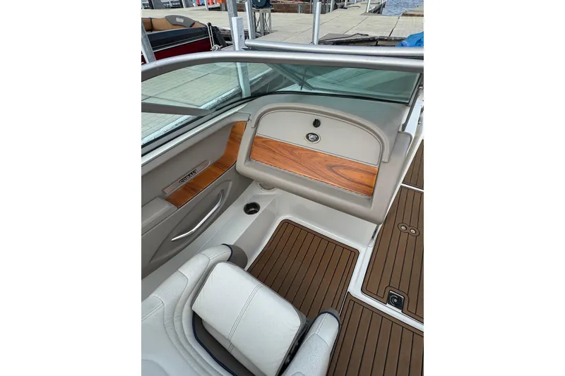 Slide: The Image of Interior of a 2000 Cobalt 226 boat with wood accents and seating. - 13